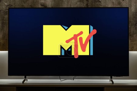 Photo for POZNAN, POL - DEC 19, 2023: Flat-screen TV set displaying logo of MTV, an American pay television channel,  based in New York City - Royalty Free Image