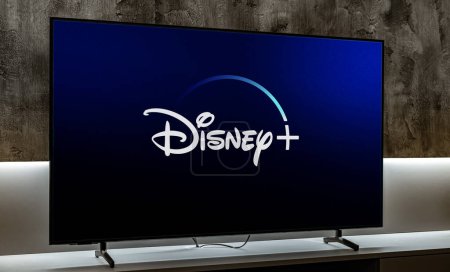 Photo for POZNAN, POL - DEC 19, 2023: Flat-screen TV set displaying logo of Disney+, an American subscription video on-demand streaming service owned and operated by the DTCI division of The Walt Disney Company - Royalty Free Image