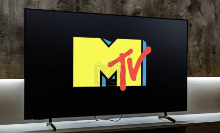 Photo for POZNAN, POL - DEC 19, 2023: Flat-screen TV set displaying logo of MTV, an American pay television channel,  based in New York City - Royalty Free Image