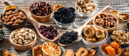 Photo for Composition with a variety of dried fruits and assorted nuts. Delicacies. - Royalty Free Image