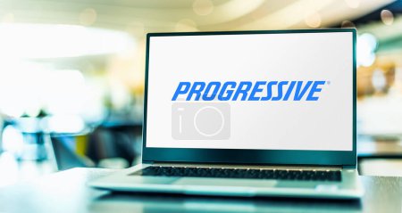 Photo for POZNAN, POL - JAN 23, 2024: Laptop computer displaying logo of The Progressive Corporation, an American insurance company - Royalty Free Image