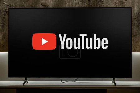 Photo for POZNAN, POL - DEC 19, 2023: Flat-screen TV set displaying logo of YouTube, an American video-sharing website headquartered in San Bruno, California. It operates as Google's subsidiaries - Royalty Free Image