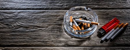 Photo for Composition with an ashtray and cigarettes. - Royalty Free Image