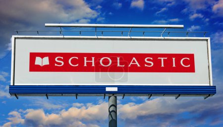 Photo for POZNAN, POL - JAN 23, 2024: Advertisement billboard displaying logo of Scholastic Corporation, an American multinational publishing, education, and media company - Royalty Free Image