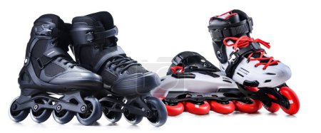 Téléchargez les photos : Deux paires de patins à roues alignées isolés sur fond blanc. - en image libre de droit