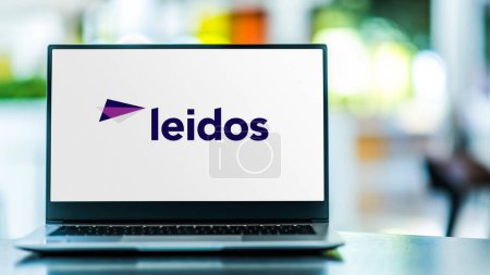 Photo for POZNAN, POL - FEB 9, 2024: Laptop computer displaying logo of Leidos Holdings, a defense, aviation, information technology, and biomedical research company headquartered in Reston, Virginia, USA - Royalty Free Image
