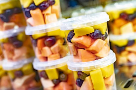 Photo for Pre-packaged fruit salads displayed in a commercial refrigerator - Royalty Free Image