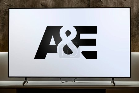 Photo for POZNAN, POL - MAR 01, 2024: Flat-screen TV set displaying logo of A and E, an American pay television network, the flagship television property of A and E Networks - Royalty Free Image