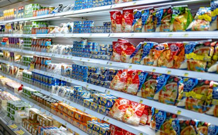 Photo for MUSCAT, OMAN - MAR 14, 2024: Dairy products put out for sale in a commercial refrigerator in supermarket - Royalty Free Image