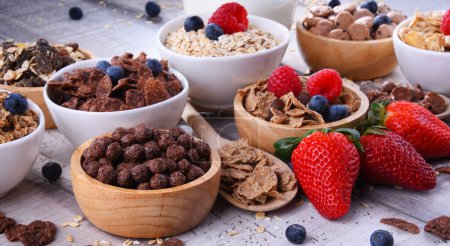Photo for Bowls containing different sorts of breakfast cereal products. - Royalty Free Image