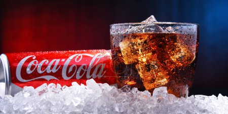 Photo for POZNAN, POL - AUG 13, 2019: A glass and a can of Coca-Cola, a carbonated soft drink manufactured by The Coca-Cola Company headquartered in Atlanta, Georgia, USA - Royalty Free Image