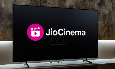 Photo for POZNAN, POL - MAY 06, 2024: Flat-screen TV set displaying logo of JioCinema, an Indian over-the-top media streaming service owned by Viacom18, a joint venture of Reliance Industries and Paramount Global - Royalty Free Image