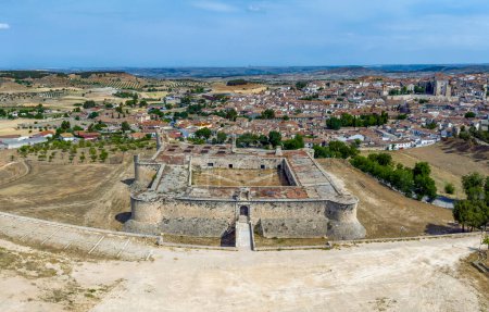 Photo for Panoramic aerial view of the Medieval Castle of Chinchon, province of Madrid. cataloged as beautiful towns of Spain - Royalty Free Image