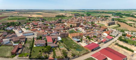 Photo for Aerial panoramic view of Grajal de Campos, nestled in the lands of Leon, this corner of tranquility breathes the essence of Spanish rural life. - Royalty Free Image