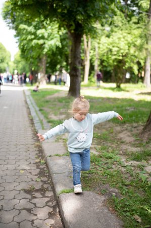Photo for Child playing in the park. Summer time/ - Royalty Free Image