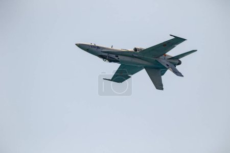 Photo for TORRE DEL MAR, MALAGA, SPAIN-JUL 30: Aircraft F-18 Hornet taking part in a exhibition on the 2nd airshow of Torre del Mar on July 30, 2017, in Torre del Mar, Malaga, Spain - Royalty Free Image