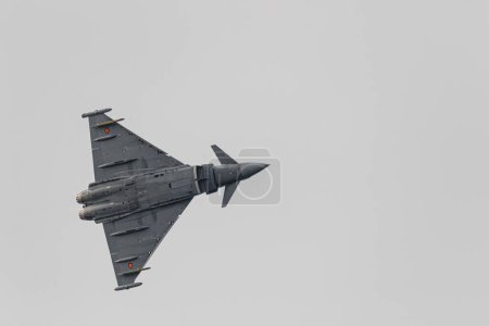 Photo for TORRE DEL MAR, MALAGA, SPAIN-JUL 12: Aircraft Eurofighter Typhoon C-16 taking part in a exhibition on the 4th airshow of Torre del Mar on July 12, 2019, in Torre del Mar, Malaga, Spain - Royalty Free Image