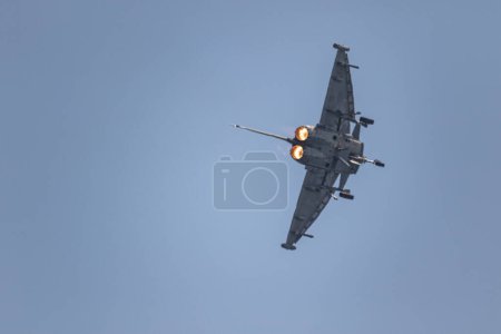 Photo for TORRE DEL MAR, MALAGA, SPAIN-JUL 14: Aircraft Eurofighter Typhoon C-16 taking part in a exhibition on the 4th airshow of Torre del Mar on July 14, 2019, in Torre del Mar, Malaga, Spain - Royalty Free Image