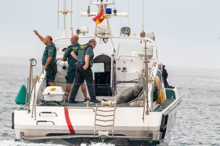 Photo for TORRE DEL MAR, MALAGA, SPAIN-JUL 12: Guardia Civil coast guard patrol taking part in a exhibition on the 4th airshow of Torre del Mar on July 12, 2019, in Torre del Mar, Malaga, Spain - Royalty Free Image