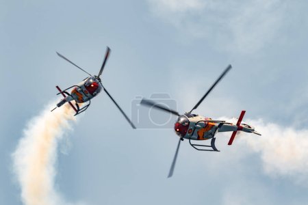 Photo for MOTRIL, GRANADA,  SPAIN-JUN 17: Patrulla Aspa, Helicopter Eurocopter EC-120 Colibri taking part in an exhibition on the 13th airshow of Motril on June 17, 2018, in Motril, Granada, Spain - Royalty Free Image