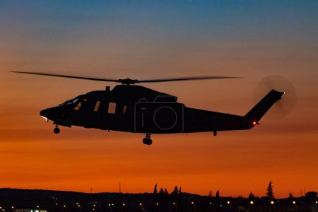 Photo for ARMILLA, GRANADA,  SPAIN-OCT 04: Helicopter Sikorsky S-76C taking part in the 1st Spotting night of the Ala 78 October 04, 2018, in Armilla, Granada, Spain - Royalty Free Image