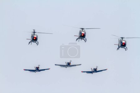 Photo for MOTRIL, GRANADA,  SPAIN-JUN 26: Cartouche Dore patrol and Patrulla Aspa taking part in an exhibition on the 11th airshow of Motril on June 26, 2016, in Motril, Granada, Spain - Royalty Free Image