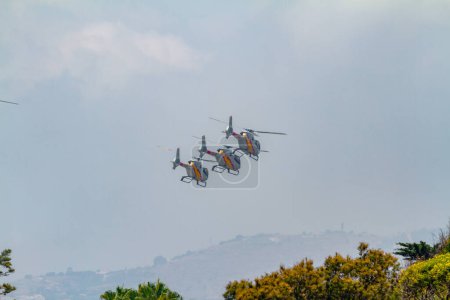 Photo for MOTRIL, GRANADA,  SPAIN-JUN 26: Patrulla Aspa, Helicopter Eurocopter EC-120 Colibri taking part in an exhibition on the 11th airshow of Motril on June 26, 2016, in Motril, Granada, Spain - Royalty Free Image