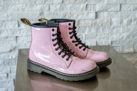 Photo for Calgary, Alberta - January 29, 2023: Pink patent leather Dr. Martens kids boots. - Royalty Free Image
