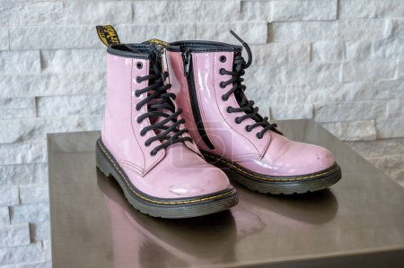 Photo for Calgary, Alberta - January 29, 2023: Pink patent leather Dr. Martens kids boots. - Royalty Free Image