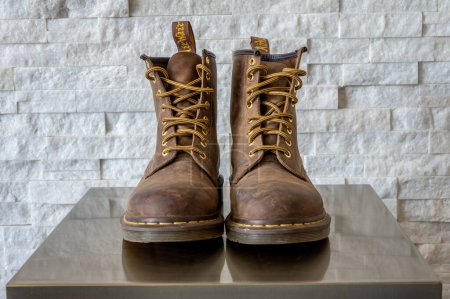 Photo for Calgary, Alberta - January 29, 2023: Brown leather Dr. Martens kids boots. - Royalty Free Image