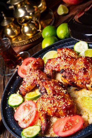 Foto de Couscous with fried chicken wings spicy - Imagen libre de derechos