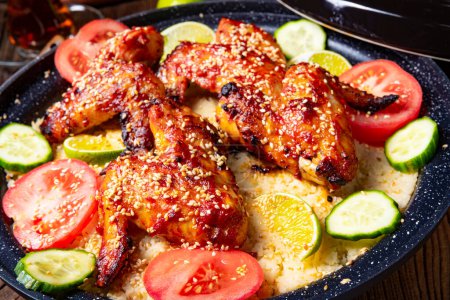 Foto de Couscous with fried chicken wings spicy - Imagen libre de derechos