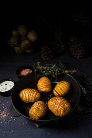 Photo for Hasselback potatoes with quark and herbs - Royalty Free Image