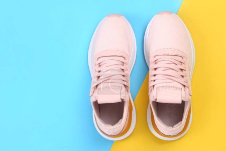 Photo for Pair of sport shoes on colorful background. copy space.Overhead shot of running shoes. Top view, flat lay - Royalty Free Image