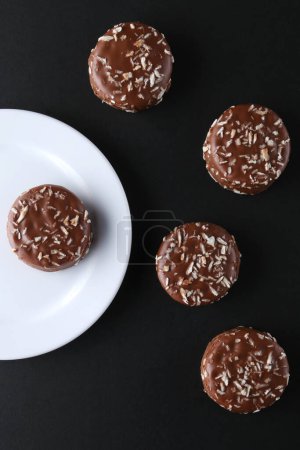 Photo for Chocolate cookies with coconut shaving chocolate coating and coconut - Royalty Free Image