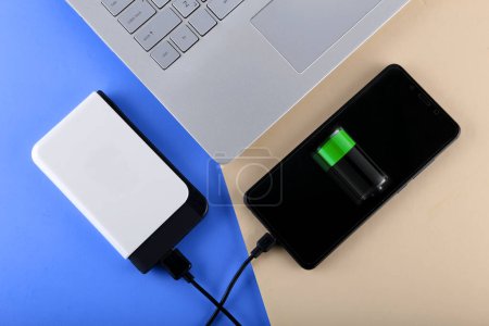 Photo for Smartphone Charging Via Power Bank - Royalty Free Image
