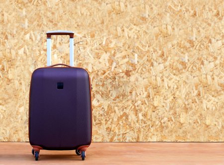 Photo for Close up trolly bag luggage on texture background - Royalty Free Image