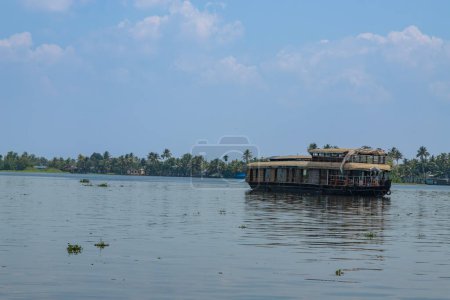 Photo for House boat under blue sky from Alleppey or AlappuzhaKerala.Kerala Backwaters, houseboat Photo - Royalty Free Image