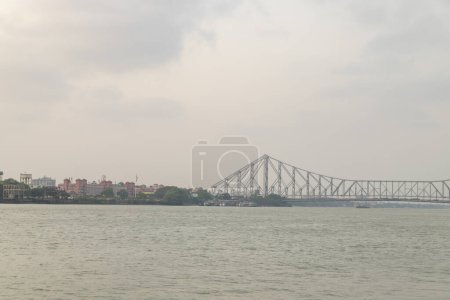 Photo for The Howrah Bridge over the holy river Ganges communicating in between Howrah and Calcutta. British period Bridge. - Royalty Free Image