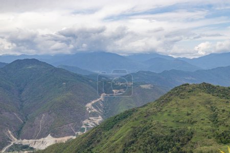 Landscape of the high mountain range at dirang arunachal pradesh northeastern India.The main highway under construction and maintenance through the hmalyas connecting assam with tawang as seen near dirang, arunachal pradesh, India.