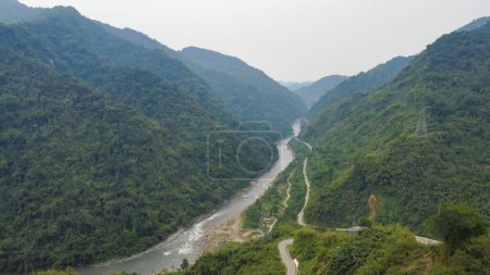 Photo for The kameng river in a deep valley surrounded by mountains of the himalayas near pinjoli stream arunachal pradesh, India. - Royalty Free Image