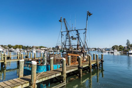 Photo for BARNSTABLE, USA - SEP 24, 2017: old lobster fish trawler Miss Kara at the pier in Barnstable harbor. Lobster fishing was in former times the most important industry in Barnstable, USA. - Royalty Free Image
