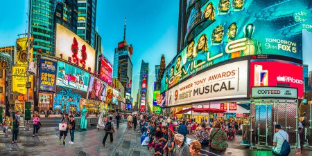 Photo for NEW YORK, USA  OCT 4, 2017:  neon advertising of News, brands and theaters at times square in late afternoon. Times square is a symbol for New York life and amusement. - Royalty Free Image