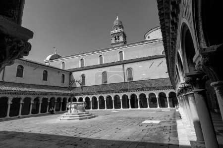 Photo for Venice, Italy -April 10, 2007: courtyard at the church of San Michele cemetery ground.  San Michele is since centuries the most important cemetery of Venice. - Royalty Free Image