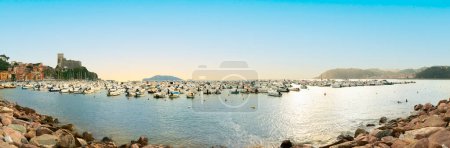 Photo for Lerici, Italy - August 7, 2019: A panorama view of the boats in the Bay of Poets from the path leading to the castle at Lerici, Italy in summertime - Royalty Free Image