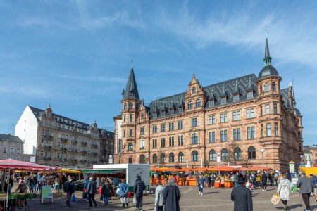 Photo for Wiesbaden, Germany - February 20, 2021: people enjoy shopping at the farmers market in Wiesbaden, Germany. - Royalty Free Image