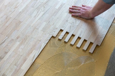 Photo for Raw parquet in detail with wooden single rods - Royalty Free Image