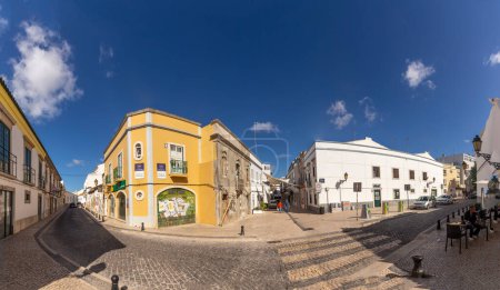 Photo for Faro, Portugal - October 3, 2020: old cobble stone street in the old town of Faro, Portugal, Algarve in panoramic view. - Royalty Free Image