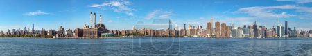 Foto de New York, USA - October 6, 2017: panorama of New York with river Hudson and blue sky. - Imagen libre de derechos