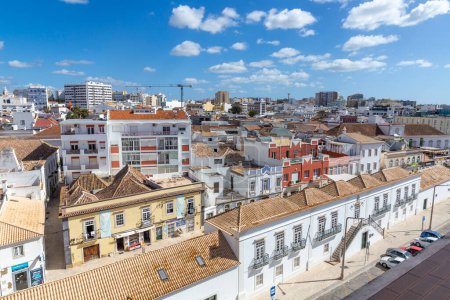 Photo for Faro, Portugal - October 3, 2020: view to old town of Faro, Portugal, Algarve with mixture of modern and old traditional architecture. - Royalty Free Image